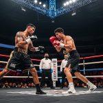 Editorial view of boxing ring and crowd in Southeast Asia